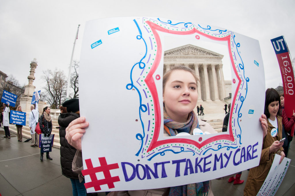 March 4, 2015: Hundreds of supporters of the Affordable Care Act rallied on the steps of the Supreme Court as the Court heard oral arguments in King v. Burwell. SEIU members, including registered nurses, front-line healthcare workers, consumers and other working women and men stood together in the rain—singing, chanting and cheering on behalf of the millions of people whose lives have been changed for the better by the ACA. ~ Washington, DC ~ Photo by David Sachs / SEIU
