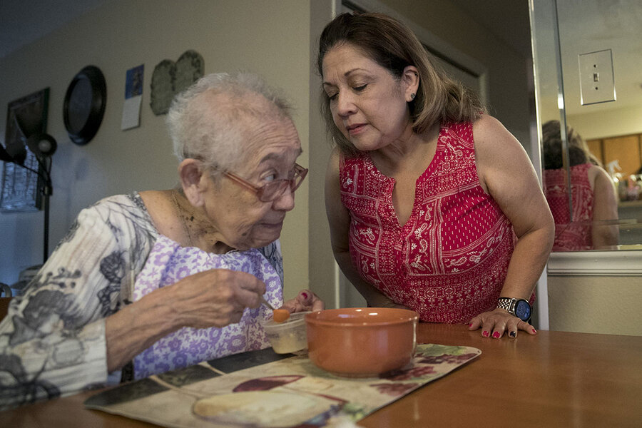 Mary Ellen Tolentino (right) helps her mother with Alzheimer's in Austin, Texas, on June 26, 2019.