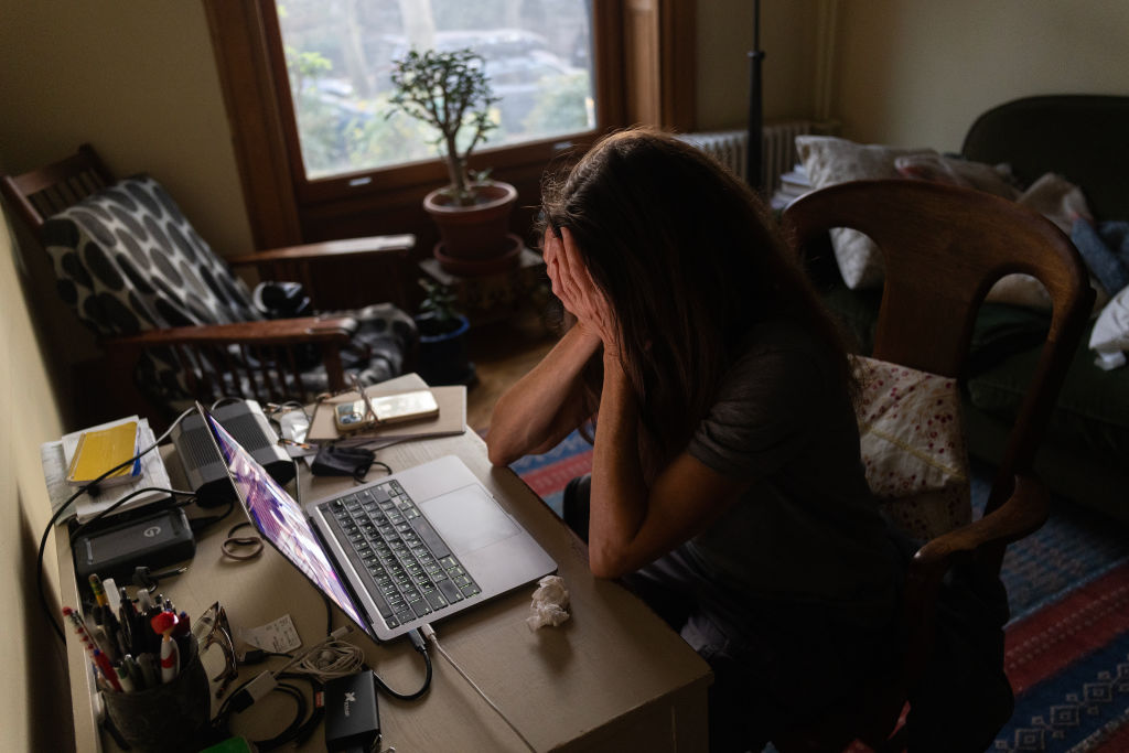 A woman watches Vice President Kamala Harris' concession speech in her home on Nov. 6, 2024, in Brooklyn, N.Y. 