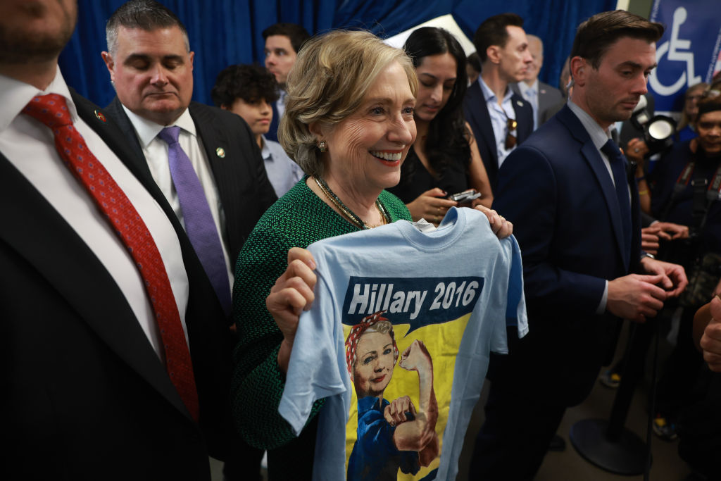 Hillary Clinton holds a "Hillary 2016" t-shirt.