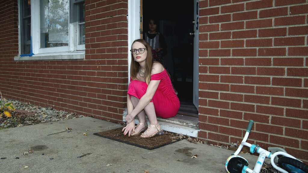 Victoria Villanueva pictured outside her home with one of her children in the background.