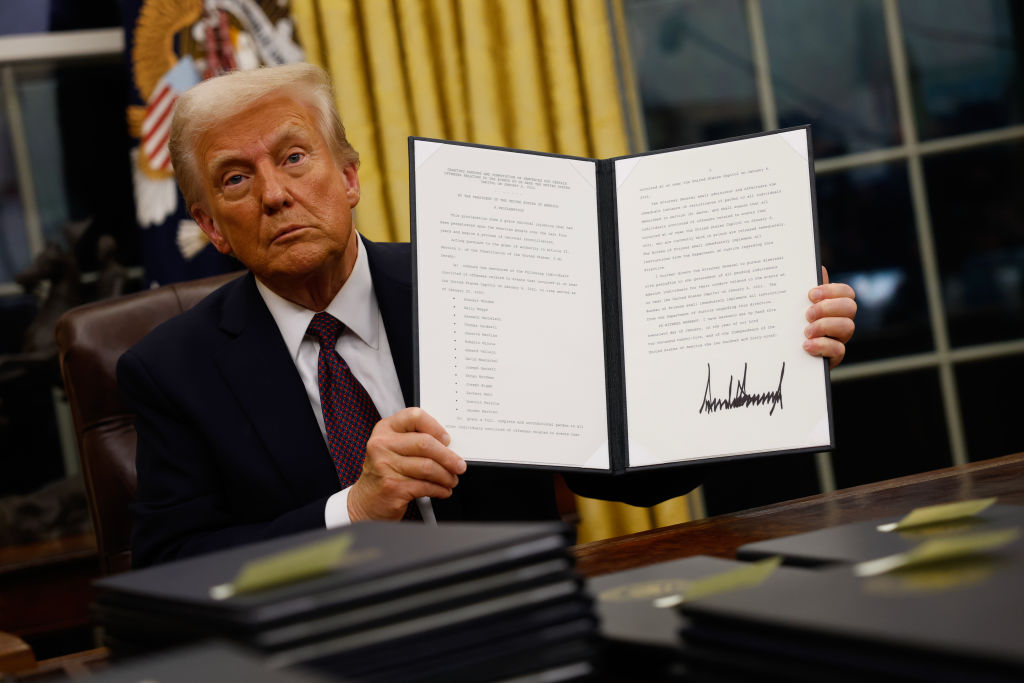 Donald Trump signs executive orders in the Oval Office