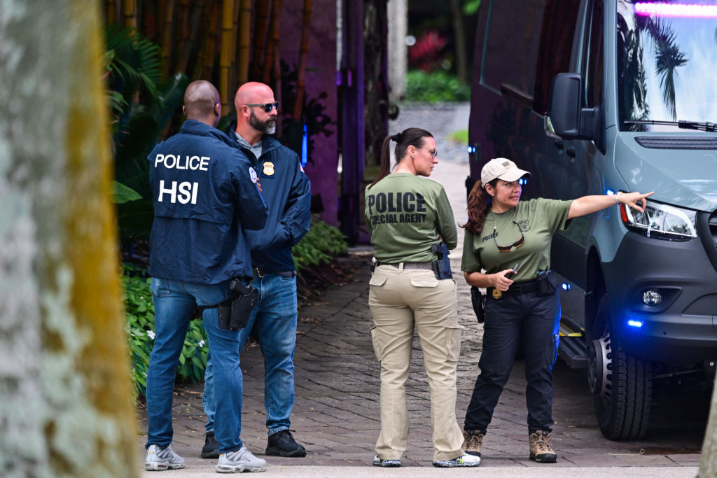 Four police officers raid Sean "Diddy" Combs' home for evidence of trafficking and assault.