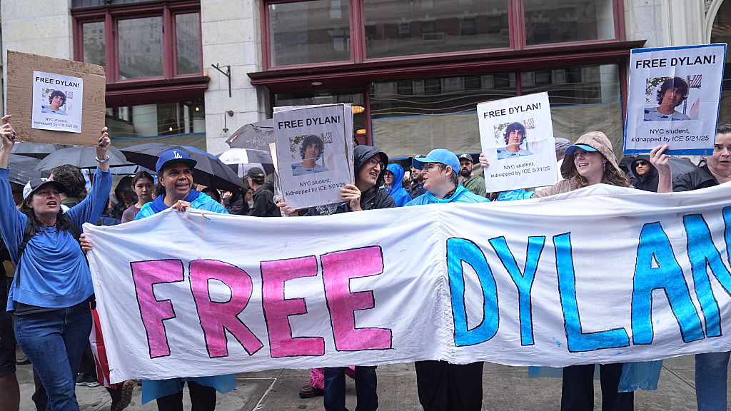 Multiple protestors carry a banner and signs that say, "Free Dylan! NYC student, kidnapped by ICE 5/21/25"