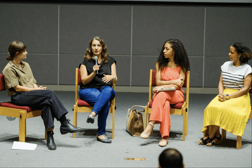 Four women sit and speak at Tulane Unviersity's panel and screening of Before a Breath, co-hosted with the organization Saul's Light.