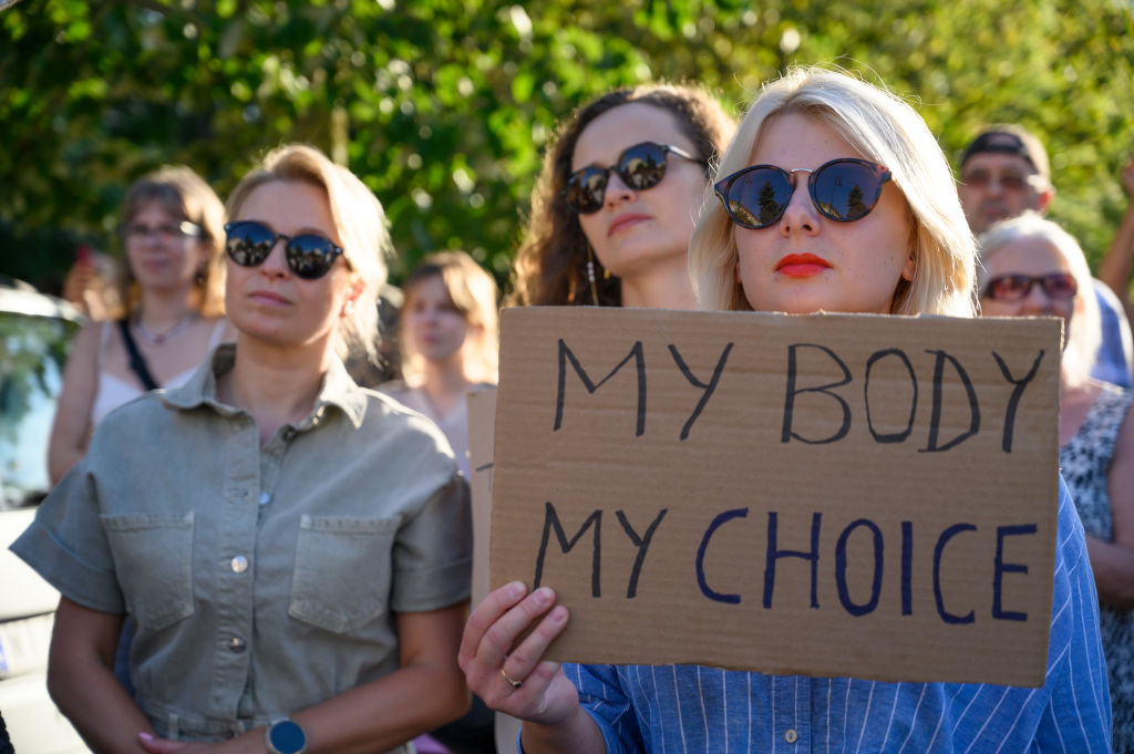 The Strange Hopefulness of Growing a Human While the World Burns