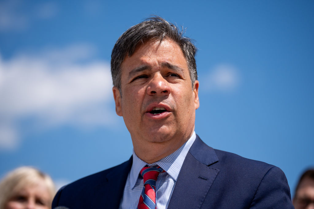 Idao Attorney General Raul Labrador, a man with salt and pepper hair wearing a blue suit, is photographed up close as he speaks outside the Supreme Court.
