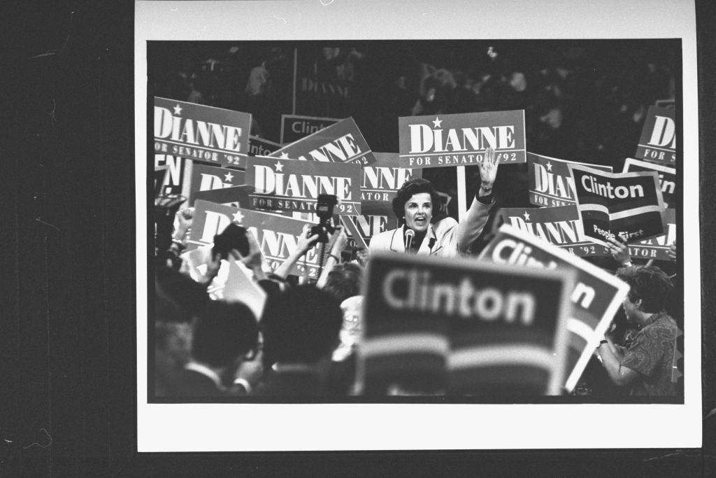 delegates who are carrying DIANNE FOR SENATOR '92 & CLINTON, PEOPLE FIRST signs
