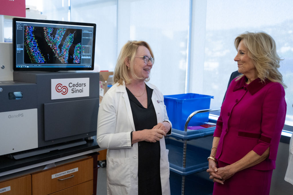 A female doctor converses with former First Lady Jill Biden during her tour of Cedars-Sinai Medical Center.