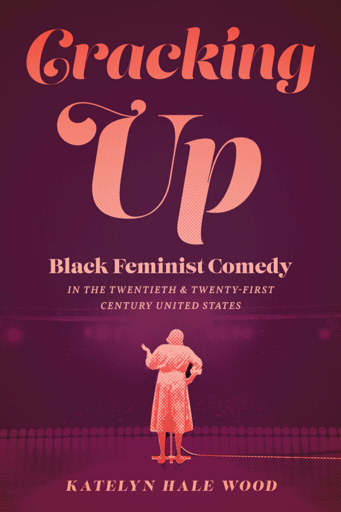 The cover of Katelyn Hale Wood's book, Cracking Up, has a purple background and a pink silohuette of a woman on a stage.