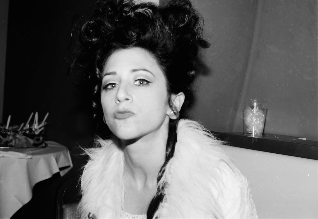 In this black and white photo, Beth Lapides makes a kissing face at the camera.