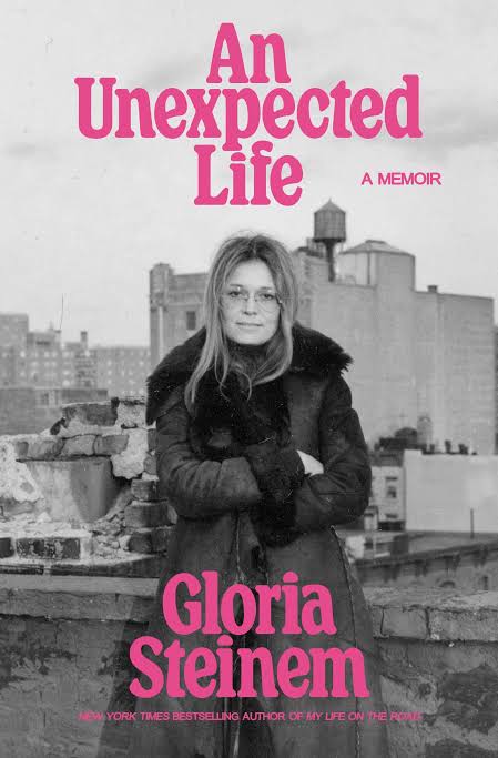 The cover of Gloria Steinem's book features a black and white photo of her form the 1970s with the title "An Unexpected Life" written in pink above her head.